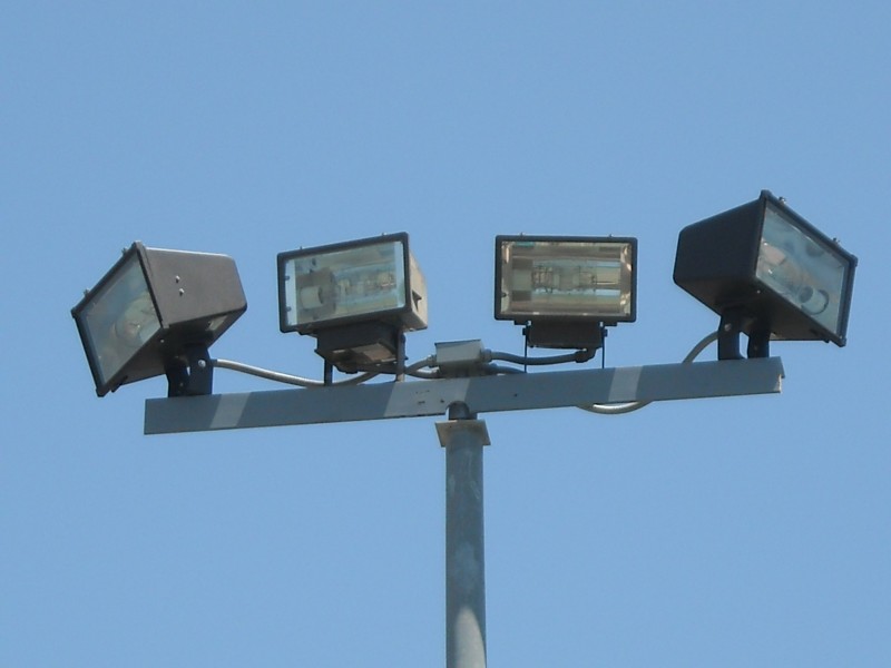 UCI install two light heads with new mounting bracket for aroyo vista student housing development basket ball court Universi